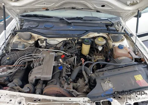 1990 Audi 100 z USA, uszkodzony, nr VIN WAUBC5445LN067143